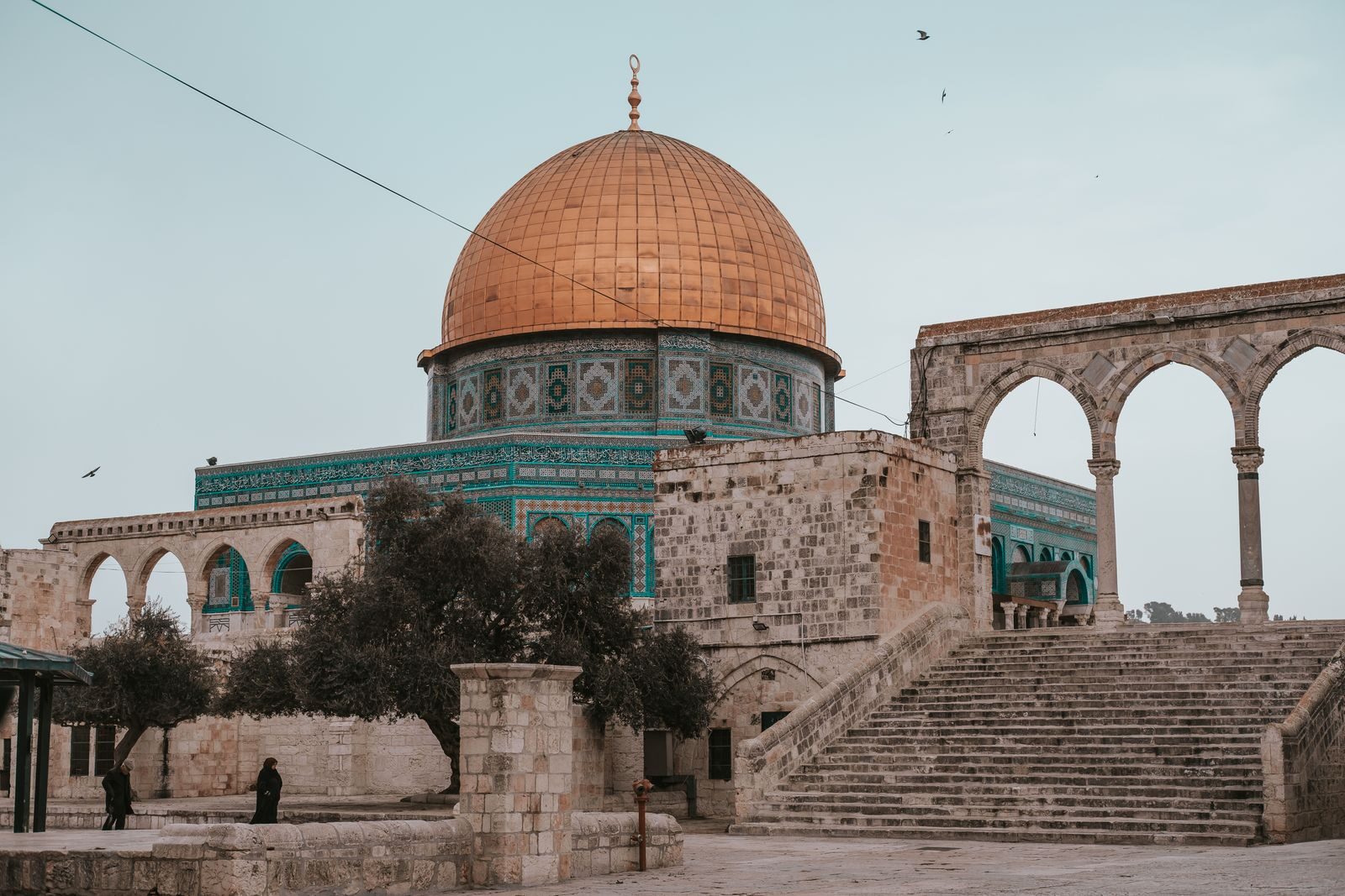 The iconic Dome of the Rock in Jerusalem with ancient architecture and vibrant hues.